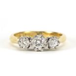 18ct gold diamond three stone ring, the central diamond approximately 3mm in diameter, size L, 3.