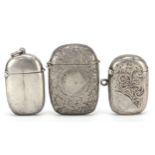 Three Victorian and later silver vestas including two with engraved floral decoration, Birmingham