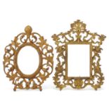 Two gilt metal acanthus design strut photo frames, the largest 30cm x 23.5cm : For Further Condition