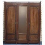 Mahogany three door compactum wardrobe with mirrored central door enclosing seven drawers, 214cm H x