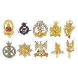 Ten British military Staybright cap badges including The Queen's Lancashire Regiment and The Blues