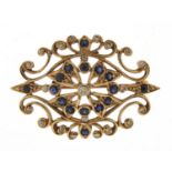 9ct gold diamond and sapphire cluster pierced brooch, the central diamond approximately 2.0mm in