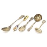 Silver spoons including a Chinese example, one enamelled and a sifting spoon, the largest 16cm in