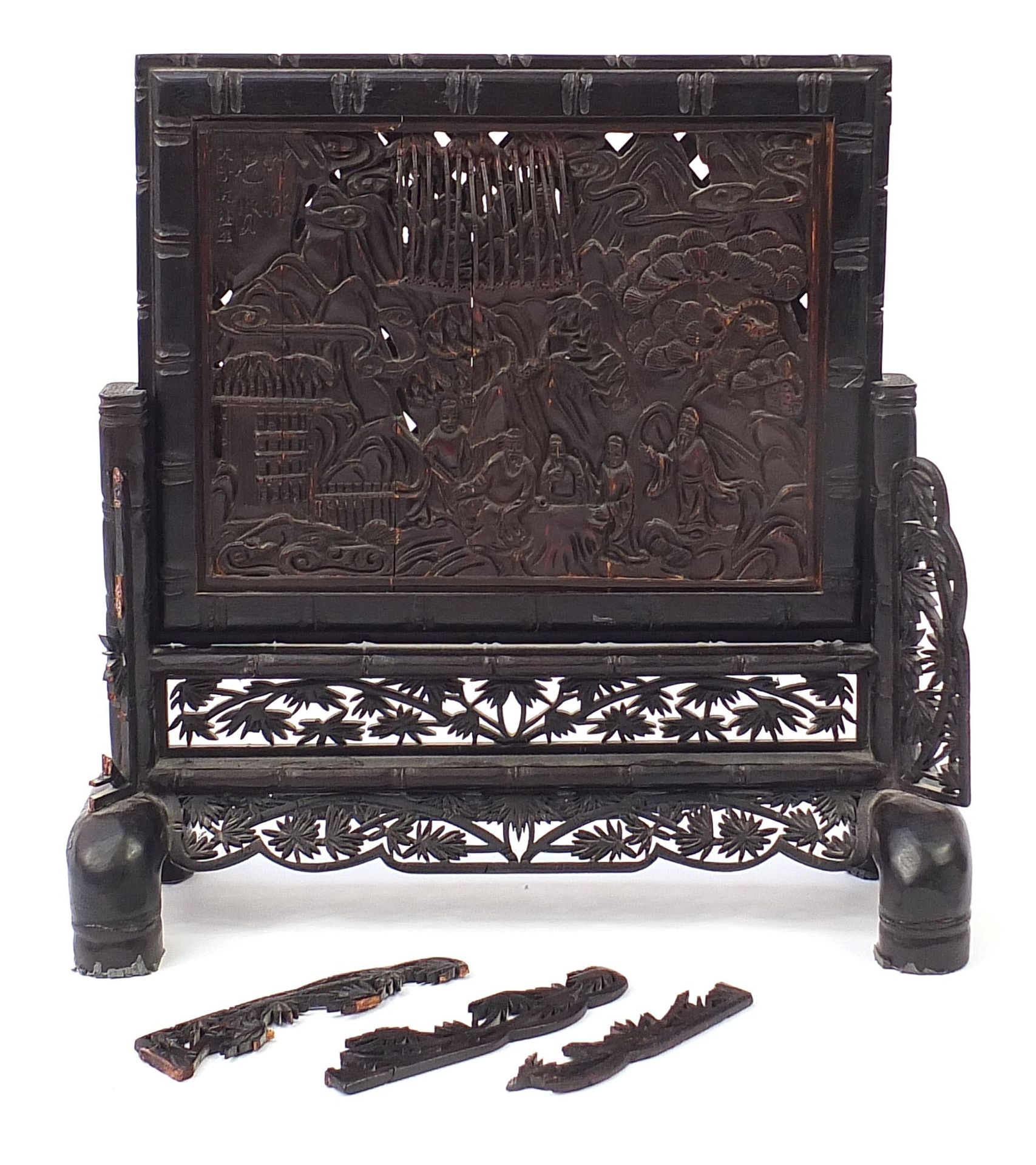 Chinese hardwood table screen profusely carved with figures in a landscape and calligraphy, 37cm