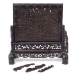 Chinese hardwood table screen profusely carved with figures in a landscape and calligraphy, 37cm