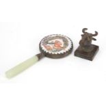 Chinese patinated bronze deer head seal and a porcelain backed hand mirror with jade handle, the