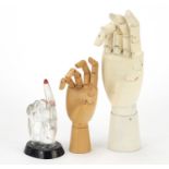 Three artist's hand models, the largest 25cm high : For Further Condition Reports Please Visit Our