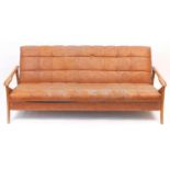 Mid century Scandinavian design teak framed day bed with brown faux leather button back upholstery,