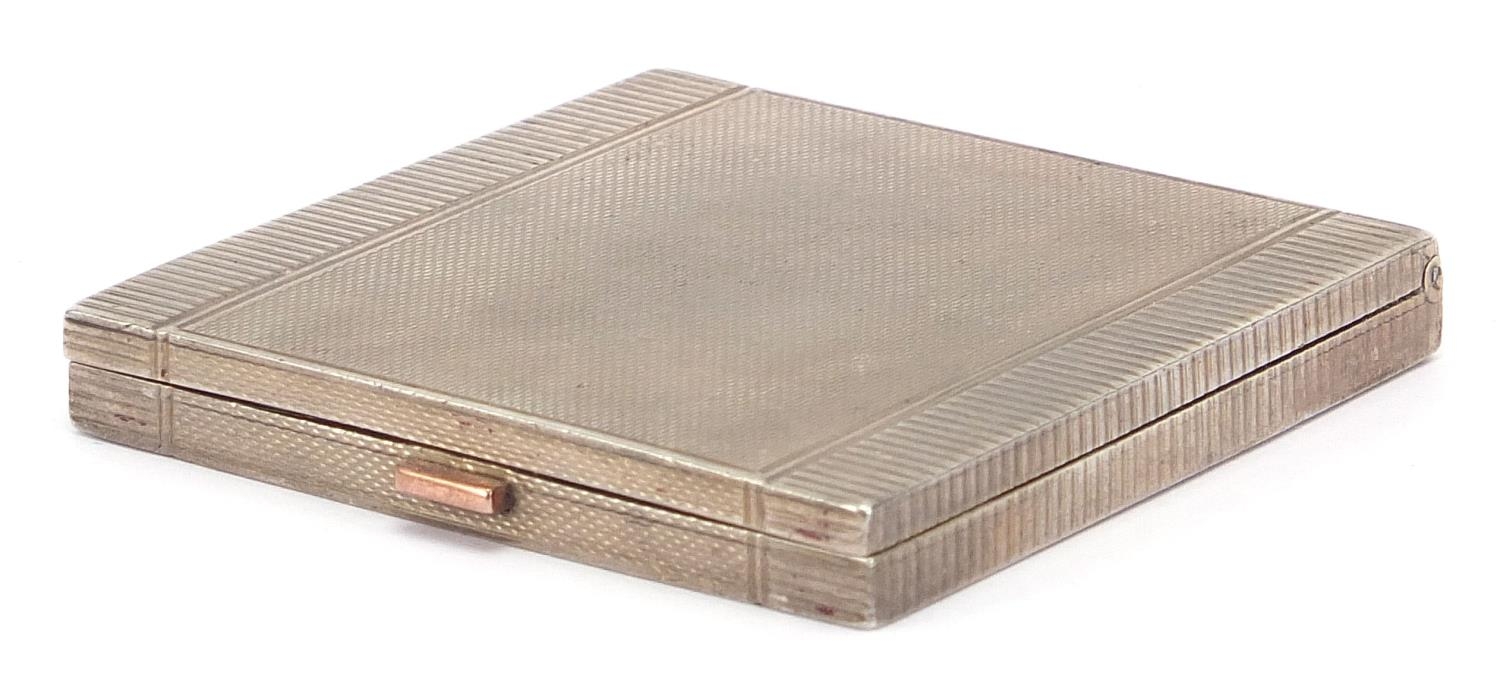 Mappin & Webb, Art Deco silver compact with engine turned decoration, London 1938, 6.5cm wide, 100.