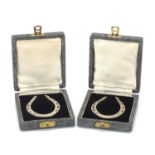 Francis Howard Ltd, pair of novelty silver horseshoe design napkin rings with velvet and silk