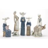 Five Lladro figurines including set of three nuns, numbers 5500, 5501 and 5502, the largest 26cm
