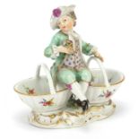 Meissen, 19th century German porcelain figural sweetmeat dish of a young boy hand painted with