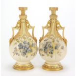 Royal Worcester, pair of Victorian blush ivory vases with twin handles, decorated and gilded with