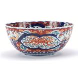 Japanese Imari porcelain bowl hand painted with phoenixes amongst flowers, 26cm in diameter : For
