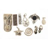 Ten silver pendants including Celtic design and a stylised horsehead, the largest 3.5cm high,