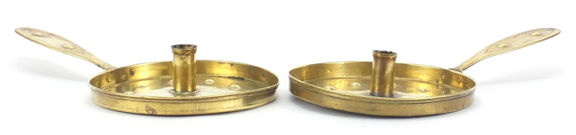 Pair of Arts & Crafts brass chamber sticks, each 35cm in length : For Further Condition Reports