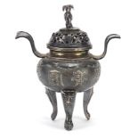 Chinese silver three footed Koro with twin handles and a cover with elephant knop, embossed with