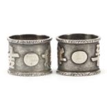 Pair of Chinese silver coloured metal napkin rings decorated with script, 2cm high, 17.0g : For
