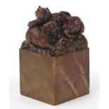 Large Chinese soapstone seal carved with three rams, character marks to the base, 12.5cm high :