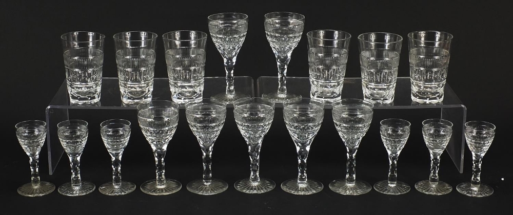 Edwardian cut glasses including two sets of six and a set of seven, the largest each 12.5cm high :