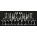Edwardian cut glasses including two sets of six and a set of seven, the largest each 12.5cm high :