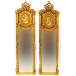 Pair of ornate gilt framed mirrors with classical female portrait design, 178cm x 50cm : For Further