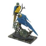 Border Fine Arts sculpture of blue and gold macaws raised on a faux marble base, limited edition