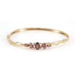 9ct gold diamond and multi gem hinged bangle, 6cm in diameter, 4.0g : For Further Condition