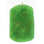Large Chinese 9ct gold mounted green jade pendant carved with a bird of paradise, 6.5cm high, 42.