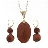 Silver goldstone pendant on a silver necklace with matching earrings, the pendant 5.5cm high,