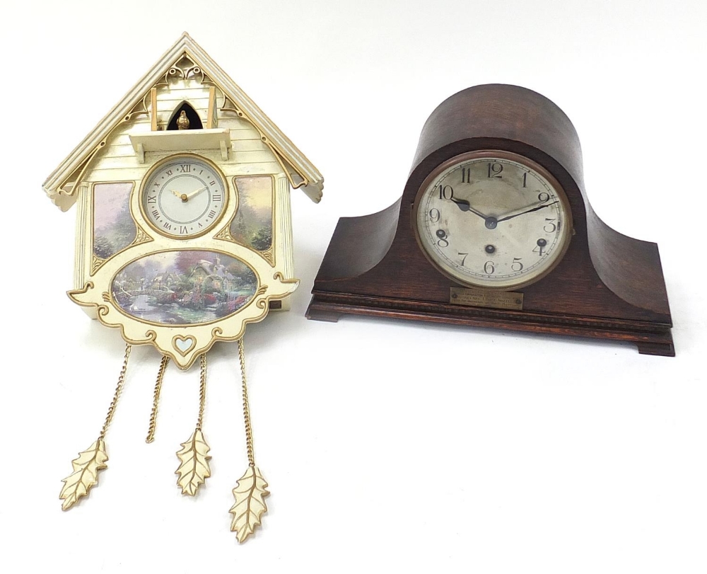Bradford Editions cuckoo clock and an oak cased mantle clock with Westminster chime, the mantle