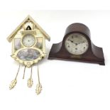 Bradford Editions cuckoo clock and an oak cased mantle clock with Westminster chime, the mantle