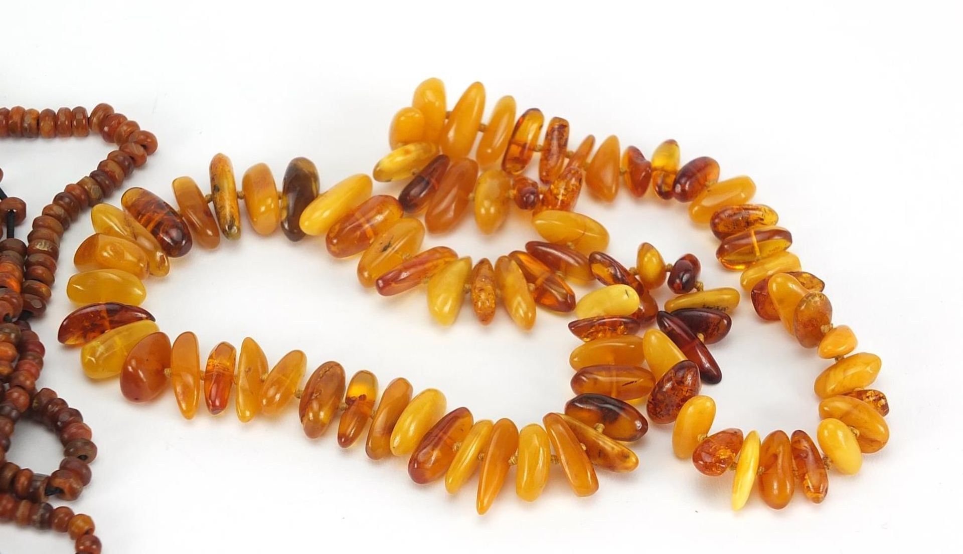 Butterscotch amber coloured bead necklace and a twelve row amber coloured necklace, total 244.2g : - Image 3 of 4
