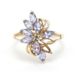 9ct gold blue diamond and purple stone flower head ring, possibly iolite or tanzanite, size N, 2.