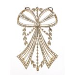 Antique unmarked gold and diamond swag and bow pendant, the central diamond approximately 3.5mm in