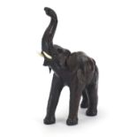 Manner of Liberty & Co, large leather covered elephant with ivorine tusks, 44cm high : For Further