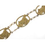 Gold coloured metal dog design bracelet, 16cm in length, 13.8g : For Further Condition Reports