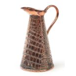 Arts & Crafts crocodile skin design copper jug, 28cm high : For Further Condition Reports Please