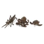 Three Japanese patinated bronze okimonos comprising octopus, turtle and locust, each with
