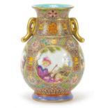 Good Chinese porcelain vase with twin handles finely hand painted in the famille rose palette in the