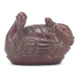 Japanese carved wood okimono of a turkey and tortoise, inset mother of pearl with character marks to