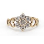 9ct gold cubic zirconia flower head ring with pierced love heart shoulders, size I, 1.3g : For