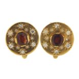 Pair of continental unmarked gold diamond and garnet clip on earrings, (tests as 15ct+ gold) 1.8cm