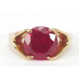 Unmarked gold ruby solitaire ring, the stone approximately 10mm in diameter, size J, 3.6g : For