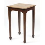 Quarter veneered and feather banded walnut occasional table raised on square tapering legs, 77cm H x