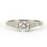 18ct white gold diamond solitaire ring with diamond shoulders, the central diamond approximately 4mm