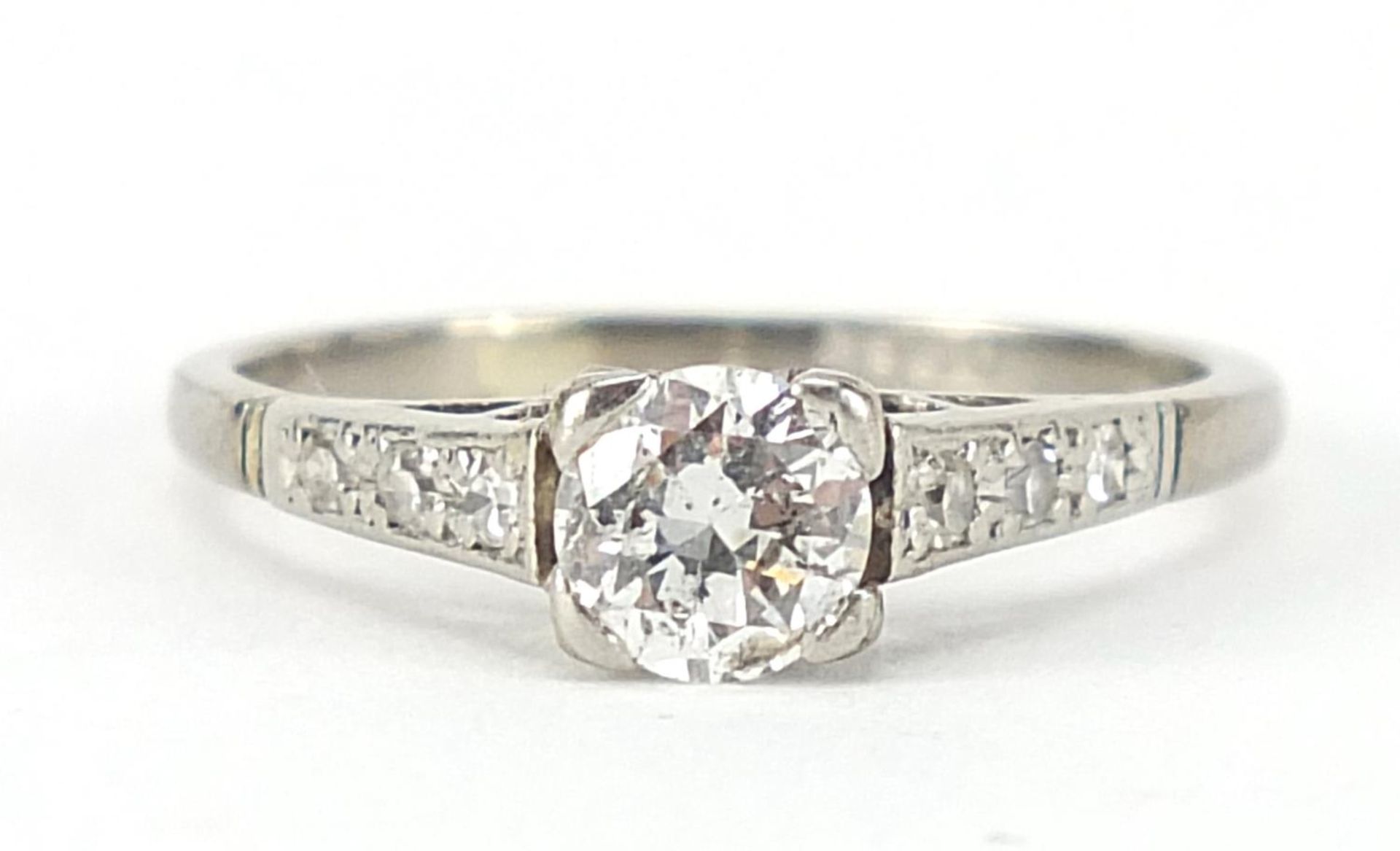 18ct white gold diamond solitaire ring with diamond shoulders, the central diamond approximately 4mm