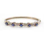 Silver blue stone and diamond hinged bangle, 7cm wide, 15.5g : For Further Condition Reports