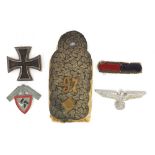 German militaria including an epaulet, Iron Cross and eagle cap badge, the largest 11.5cm in