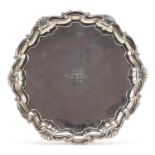 Goldsmiths & Silversmiths Company Ltd, Edward VII silver salver raised on three ball and claw